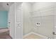Well-lit laundry room featuring washer/dryer hookups and tile floors at 125 Dayglow Dr., Loris, SC 29569