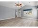 Spacious living room with updated floors, vaulted ceiling, and great natural light at 125 Dayglow Dr., Loris, SC 29569