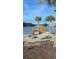 Scenic backyard with a fire pit and pier, offering a perfect spot for outdoor gatherings and enjoying waterfront views at 1330 Reflection Pond Dr., Little River, SC 29566
