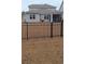 Fenced backyard with patio overlooking well-maintained lawn and pond, great for outdoor entertaining at 1330 Reflection Pond Dr., Little River, SC 29566