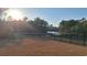 Backyard with black metal fence overlooking a lake and trees at 1330 Reflection Pond Dr., Little River, SC 29566