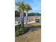 Picturesque backyard featuring a pier and cozy fire pit, ideal for relaxing by the water and enjoying the natural surroundings at 1330 Reflection Pond Dr., Little River, SC 29566