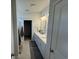 Well-lit bathroom features double sinks, neutral walls, tile floor and a walk-in shower at 1330 Reflection Pond Dr., Little River, SC 29566