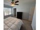 Bedroom with a ceiling fan, window, carpeted floor, and a dresser at 1330 Reflection Pond Dr., Little River, SC 29566