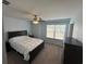 Cozy bedroom with natural light, dark furniture, carpet, and a ceiling fan at 1330 Reflection Pond Dr., Little River, SC 29566