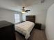 Bedroom features a ceiling fan, neutral carpet, and a wooden headboard at 1330 Reflection Pond Dr., Little River, SC 29566