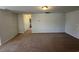 Bonus room with brown carpet, neutral paint, and a view into another area of the home at 1330 Reflection Pond Dr., Little River, SC 29566
