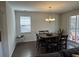 Dining room featuring a chandelier, hardwood floors, table, and chairs at 1330 Reflection Pond Dr., Little River, SC 29566
