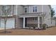 Charming two-story home with stone accents, landscaped front yard, and covered entryway at 1330 Reflection Pond Dr., Little River, SC 29566