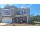 Charming two-story house with a covered front porch and well-manicured lawn at 1330 Reflection Pond Dr., Little River, SC 29566