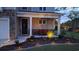 Attractive home featuring a well-maintained lawn, beautiful landscaping, and a cozy front porch for relaxed outdoor living at 1330 Reflection Pond Dr., Little River, SC 29566
