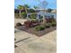 Beautifully landscaped yard with lush greenery and colorful plantings creating a serene and inviting outdoor space at 1330 Reflection Pond Dr., Little River, SC 29566