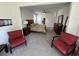 Large main bedroom suite with ceiling fan, sitting area, and neutral paint at 1330 Reflection Pond Dr., Little River, SC 29566