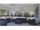 Comfortable outdoor patio with stylish furniture, ceiling fans, and views, perfect for entertaining or relaxing in the fresh air at 1330 Reflection Pond Dr., Little River, SC 29566