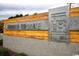 Eye-catching community signage with metal lettering, wood accent, and stone base for a modern, upscale look at 1330 Reflection Pond Dr., Little River, SC 29566