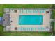 Aerial view of the fenced in community pool featuring many lounge chairs and tables for residents to use at 1440 Blue Tree Ct. # N, Myrtle Beach, SC 29588