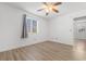 Bedroom featuring light wood laminate flooring, ceiling fan, window and a neutral color scheme at 1440 Blue Tree Ct. # N, Myrtle Beach, SC 29588