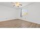 Bright bedroom with light wood laminate flooring and a ceiling fan, lit by a window with exterior view at 1440 Blue Tree Ct. # N, Myrtle Beach, SC 29588