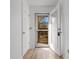 Hallway view to outdoor deck with white walls and wood look flooring at 1440 Blue Tree Ct. # N, Myrtle Beach, SC 29588