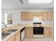 Well-lit kitchen features a breakfast bar and plenty of cabinet space for storage at 1440 Blue Tree Ct. # N, Myrtle Beach, SC 29588