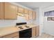 Functional kitchen features white appliances and classic cabinetry at 1440 Blue Tree Ct. # N, Myrtle Beach, SC 29588