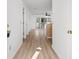 Bright living area with wood flooring, sliding glass doors to balcony, and open floor plan at 1440 Blue Tree Ct. # N, Myrtle Beach, SC 29588