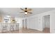 Open-concept living area with bar seating, neutral walls, and a ceiling fan at 1440 Blue Tree Ct. # N, Myrtle Beach, SC 29588