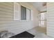 Covered porch with neutral siding, window, and door at 1440 Blue Tree Ct. # N, Myrtle Beach, SC 29588