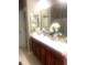 Bathroom featuring a vanity with double sinks and a large mirror at 1575 Berkshire Ave., Myrtle Beach, SC 29577