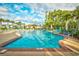 Stunning community pool with palm trees and lounge chairs for relaxation and enjoyment in a resort setting at 1575 Berkshire Ave., Myrtle Beach, SC 29577