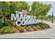 The Market Common signage surrounded by manicured landscaping and mature trees creating a beautiful entryway at 1575 Berkshire Ave., Myrtle Beach, SC 29577