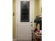 Elegant front door with decorative glass panel and sidelights, complemented by a stylish entry table at 1575 Berkshire Ave., Myrtle Beach, SC 29577