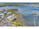 Aerial view of waterfront condos with marsh views, private dock, and a swimming pool near the water at 1582 S Waccamaw Dr. # 44, Murrells Inlet, SC 29576