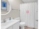 Cozy bathroom featuring a shower with a curtain, vanity, toilet, and tasteful decor at 1582 S Waccamaw Dr. # 44, Murrells Inlet, SC 29576