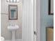 Small bathroom with pedestal sink, mirror and shower/tub combo at 1582 S Waccamaw Dr. # 44, Murrells Inlet, SC 29576