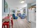 View of bright living room with seating, light wood flooring and access to outside balcony at 1582 S Waccamaw Dr. # 44, Murrells Inlet, SC 29576