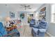 Bright living room with blue accents, light wood floors and sliding glass doors to outdoor space at 1582 S Waccamaw Dr. # 44, Murrells Inlet, SC 29576