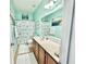 Bright bathroom with dual shower curtains, lots of counter space, and decorative paintings at 1651 Fairforest Ct., Conway, SC 29526