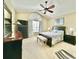 Bright bedroom features a large window, ceiling fan, and ample space for relaxation at 1651 Fairforest Ct., Conway, SC 29526