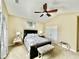 Well-lit bedroom features a ceiling fan, neutral carpet, comfortable furnishings, and light colored walls at 1651 Fairforest Ct., Conway, SC 29526
