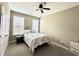 Bedroom features neutral paint, two sunny windows with blinds, a ceiling fan, and carpet at 1651 Fairforest Ct., Conway, SC 29526