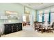 Open-concept dining room with views of the office, tall ceilings, and natural light from the windows at 1651 Fairforest Ct., Conway, SC 29526