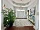 Elegant foyer with high ceilings, decorative rug, and stylish accents creating a welcoming entrance at 1651 Fairforest Ct., Conway, SC 29526