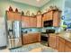 Modern kitchen with stainless steel appliances, ample cabinet space, and granite countertops at 1651 Fairforest Ct., Conway, SC 29526
