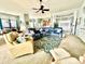 Open-concept living area with seamless flow to the dining and kitchen spaces, bathed in natural light at 1651 Fairforest Ct., Conway, SC 29526