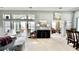 Spacious open-concept living area featuring an adjacent dining area and large windows at 1651 Fairforest Ct., Conway, SC 29526