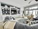 Cozy living room features a built-in entertainment center and ample natural light from large windows at 1651 Fairforest Ct., Conway, SC 29526