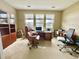 Office featuring a large desk, comfortable chairs, built-in shelving and lots of natural light at 1651 Fairforest Ct., Conway, SC 29526