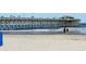 Beach and pier featuring locals and tourists enjoying the summer weather at 182 Wimbledon Way # 182, Murrells Inlet, SC 29576