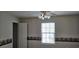 Inviting bedroom showcasing a window and neutral wall color at 182 Wimbledon Way # 182, Murrells Inlet, SC 29576